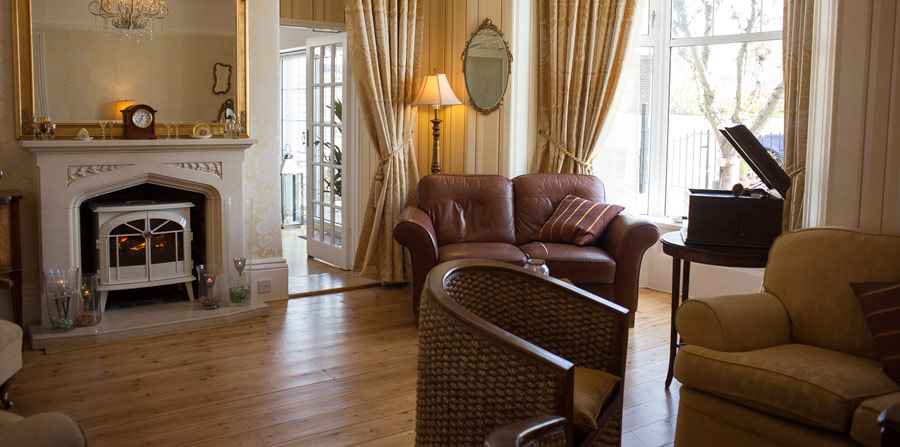 Lounge with fireplace at The Carlton Hotel