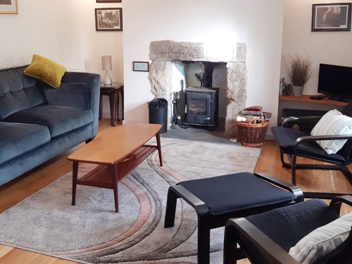 Lounge with woodburner at Casple Cottage