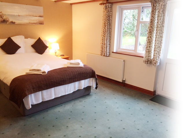 Bright lodge bedroom with garden view, Crown Lodges