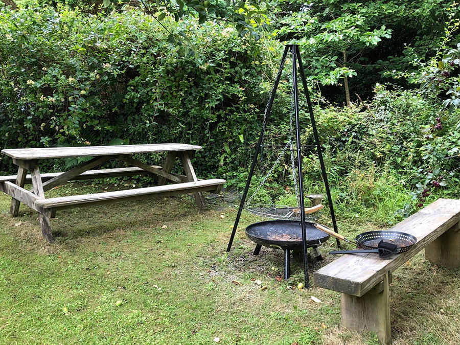 utside Picmic area and Tripod barbeque  at Foxys Shepherd's Hut Glamping Self-catering between St Ives and Penzance