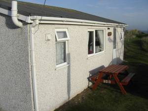 Manhattan is a detached privately owned chalet fully equipped to a high standard throughout sleeping 6 people in 3 double bedrooms. Wonderful views. Only a 5 minute walk from the beach.