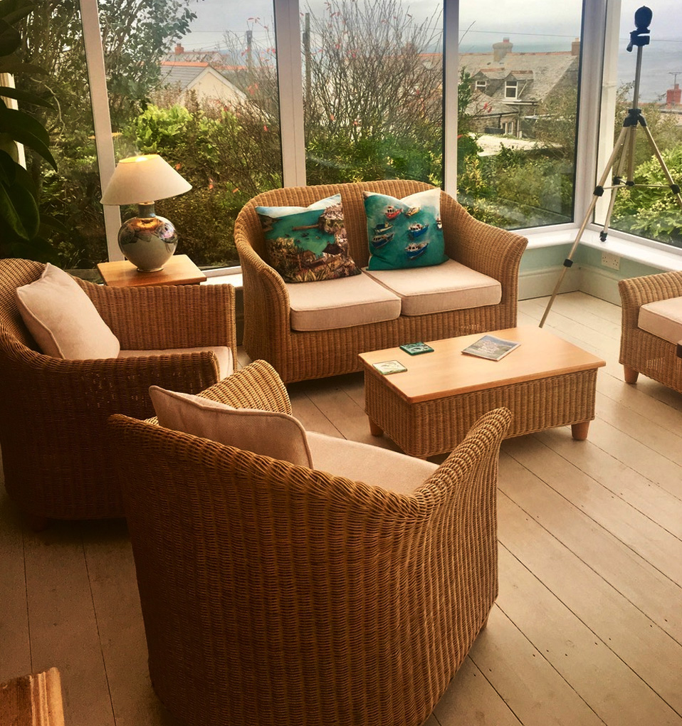 Lounge with panoramic sea views across Port Isaac bay