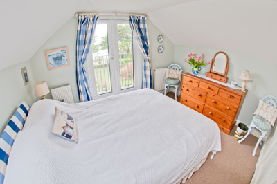 bedroom with sea views over Polzeath