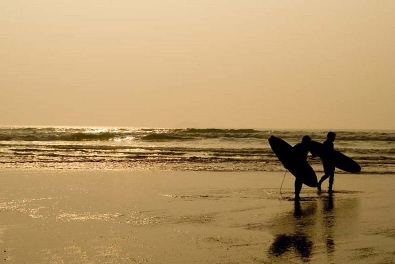 Polzeath Beach surfers