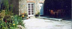 Quality self catering accommodation in a character barn conversion with beamed ceilings set in a secluded wooded valley near to Fowey.