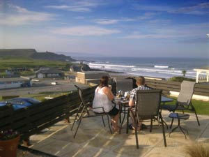 Relax on the patio and enjoy the views acroos the main surfing Beach towards Tintagel and Port Isaac