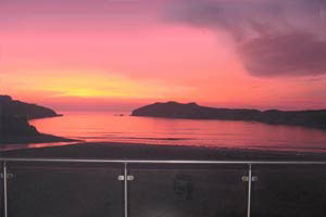 Sunset over the sands at Porth Beach 