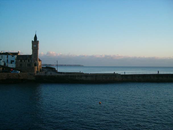 Sunset over Porthleven harbour and the clock tower