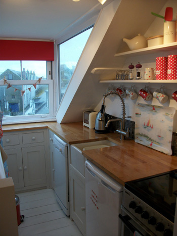 Kitchen with sea glimpse