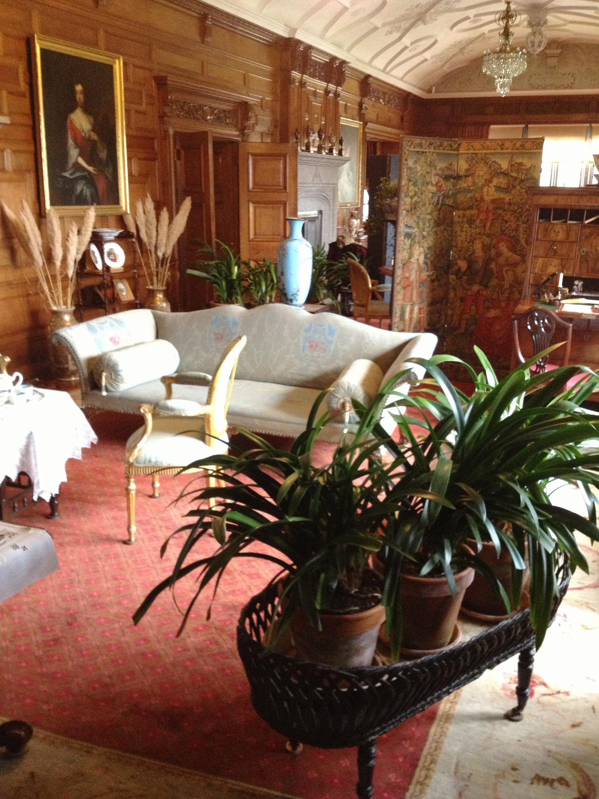 One of the family living rooms at Lanhydrock House, furnished in Victorian style