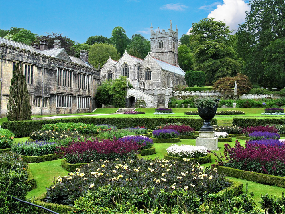 The formal gardens and the Church of St Hydroc, at Lanhydrock House, © G Laird (cc-by-sa/2.0) geograph.org.uk/p/6203805