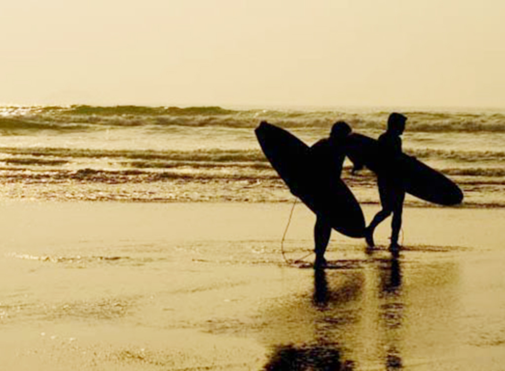 Surfers at Fistral Beach, Newquay, Cornwall