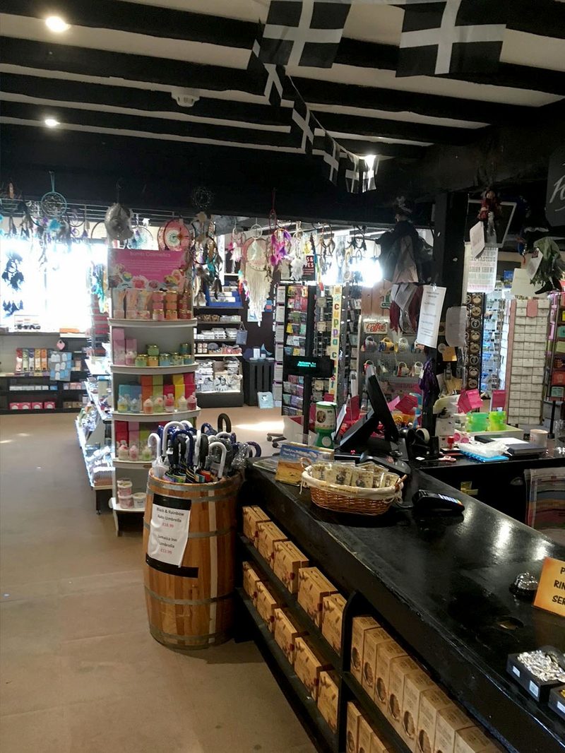 Jamaica Inn gift shop at Bolventor hung with Cornish flags - Cornwall gifts and souvenirs