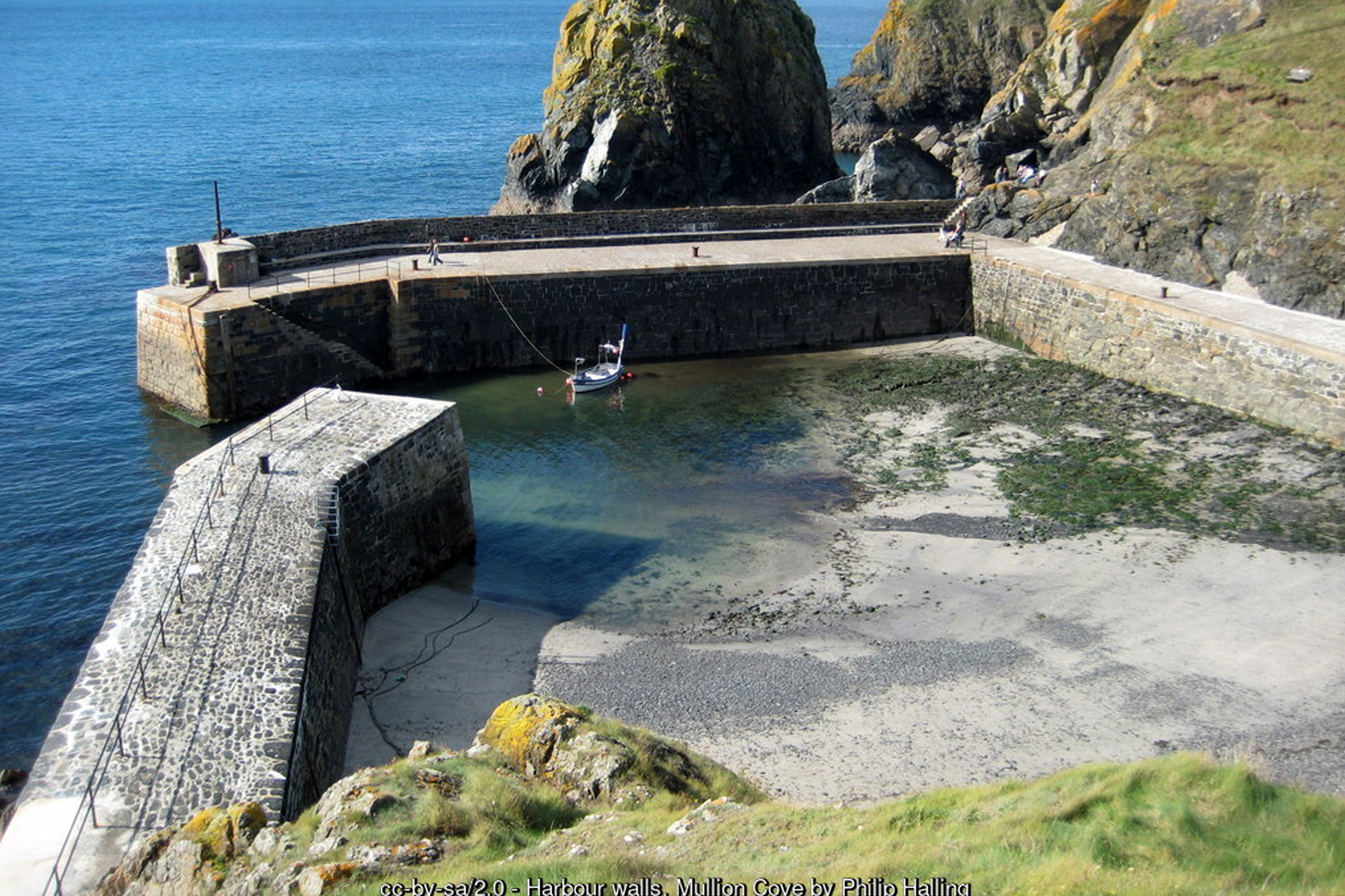 Mullion Cove's harbour walls, with the small sand and shingle beach, popular with families - Lizard Peninsula Cornwall holidays