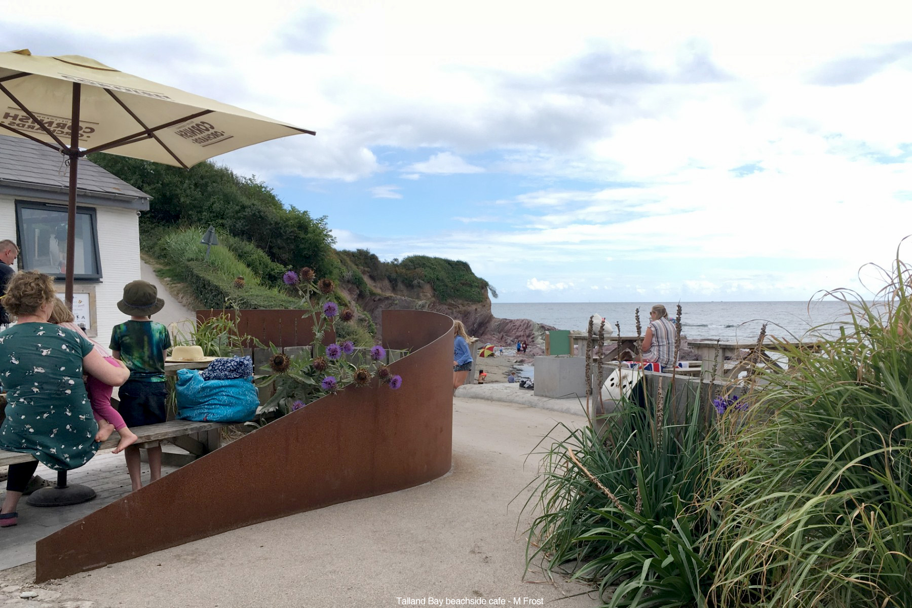 The Beach cafe on the Coastal path at Talland Bay beach between Looe and Polperro, Cornwall, looking towards Talland Sand