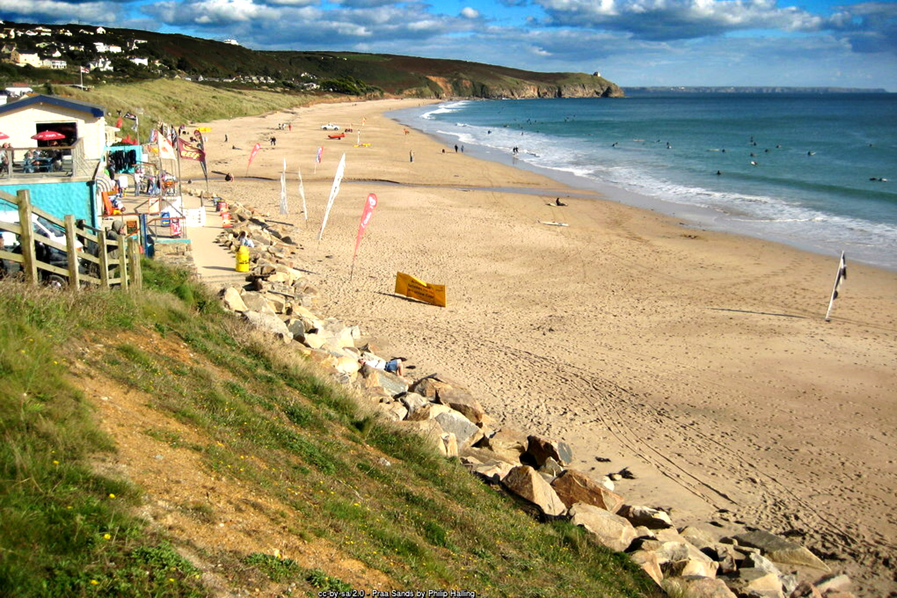 Surfers and life Guards at Praa Sands beach Cornwall, a mile of sand and dunes in Mount's Bay near Penzance and Helston