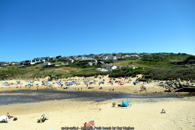 The River Menalhyl crossing the sand at Mawgan Porth beach, Cornwall