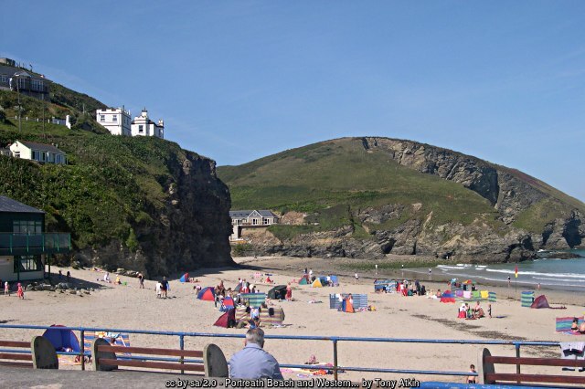 Holiday makers sunbathing on Portreath beach - Cornwall coast