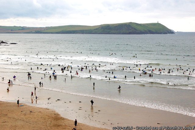 Surfing at Polzeath Beach - Cornwall coastal walking holidays