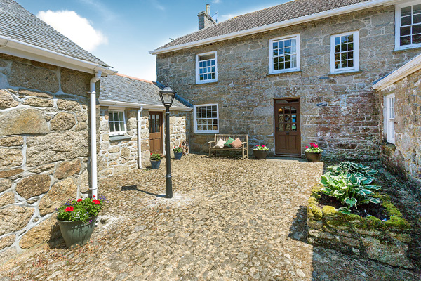 The cobbled courtyard and ground-floor suites