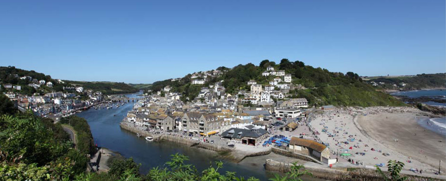 Looe - view across the harbour, the river and the main beach, south east Cornwall