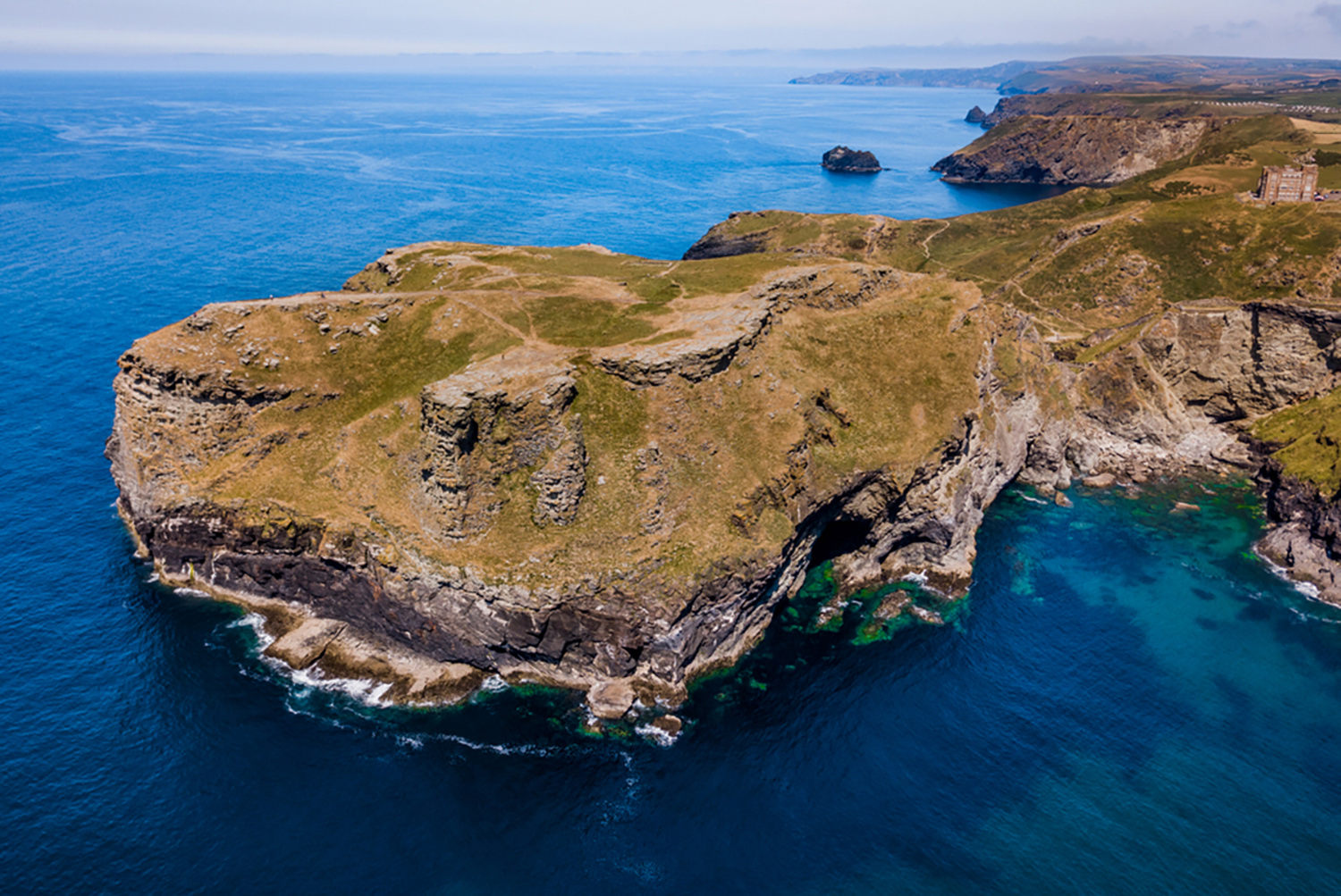 Tintagel Castle Cornwall aerial view of the headland and ruins - Cornwall coastal history attraction