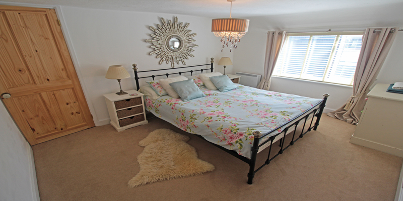 Master bedroom with king-size bed