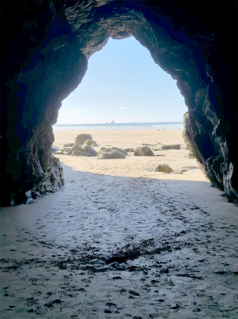 Looking out to the beach from inside a sea cave at Perranporth