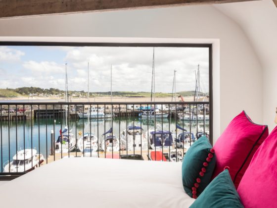 Harbour view through the glass frontage of The Grain Store, Padstow