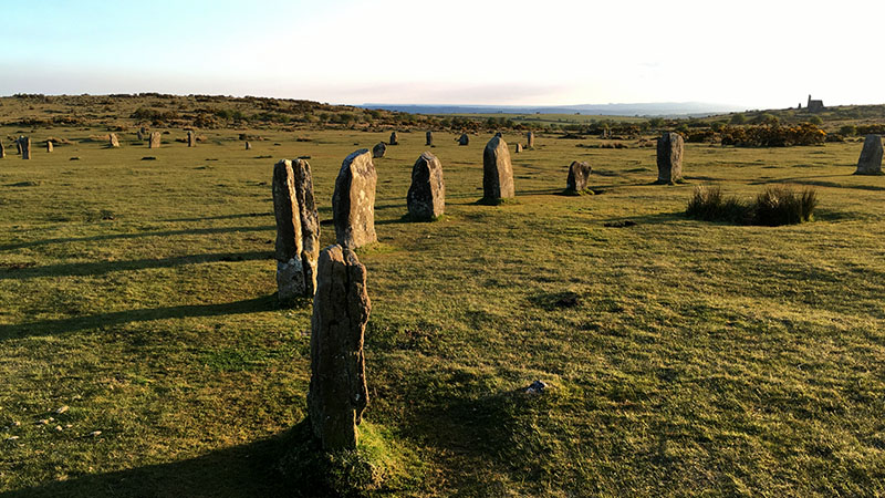 The three stone circles of The Hurlers with The Pipers standing stones beyond
