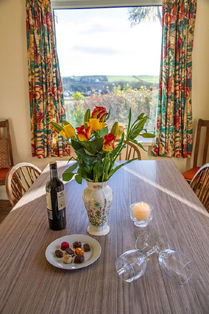 Dining table with views, Wesdale Holiday Cottage, Trebetherick
